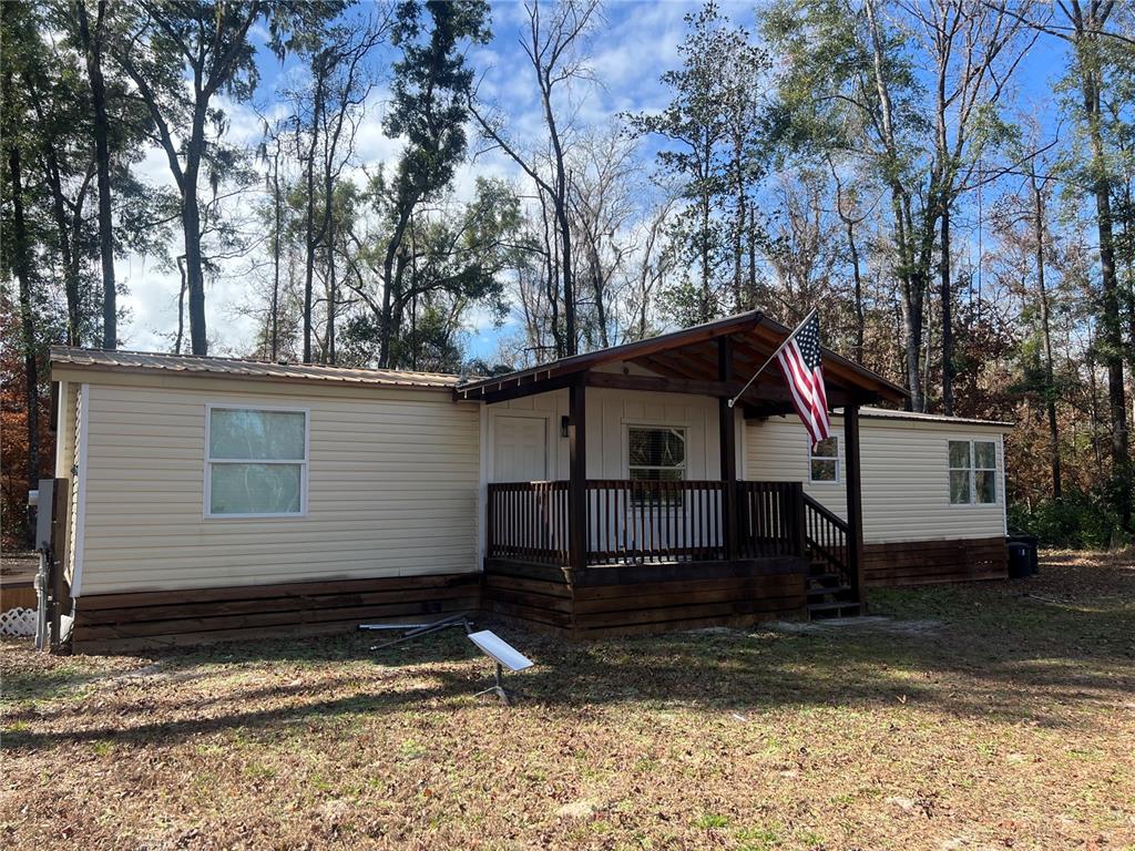 448 Southwest Central Terrace Fort White, FL 32038 - Photo 2 of 19 a view of a house with a yard