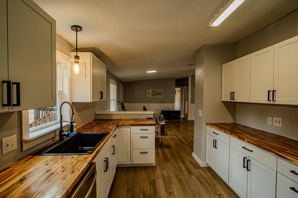 448 Southwest Central Terrace Fort White, FL 32038 - Photo 8 of 19 a kitchen with a stove a sink and a refrigerator