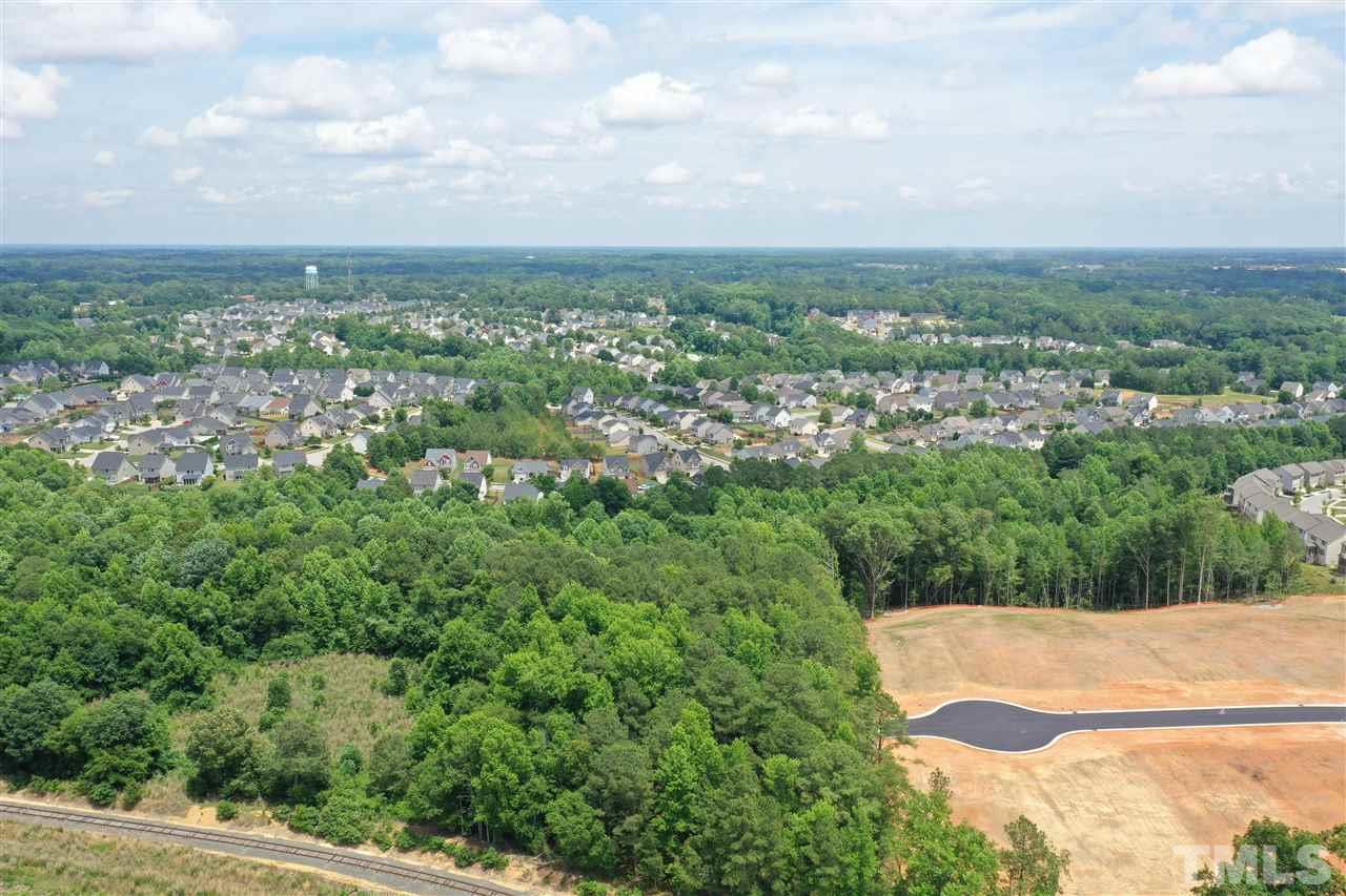 0 Fleming Loop Road Fuquay-Varina, NC 27526 - Photo 2 of 7 an aerial view of residential building and trees around