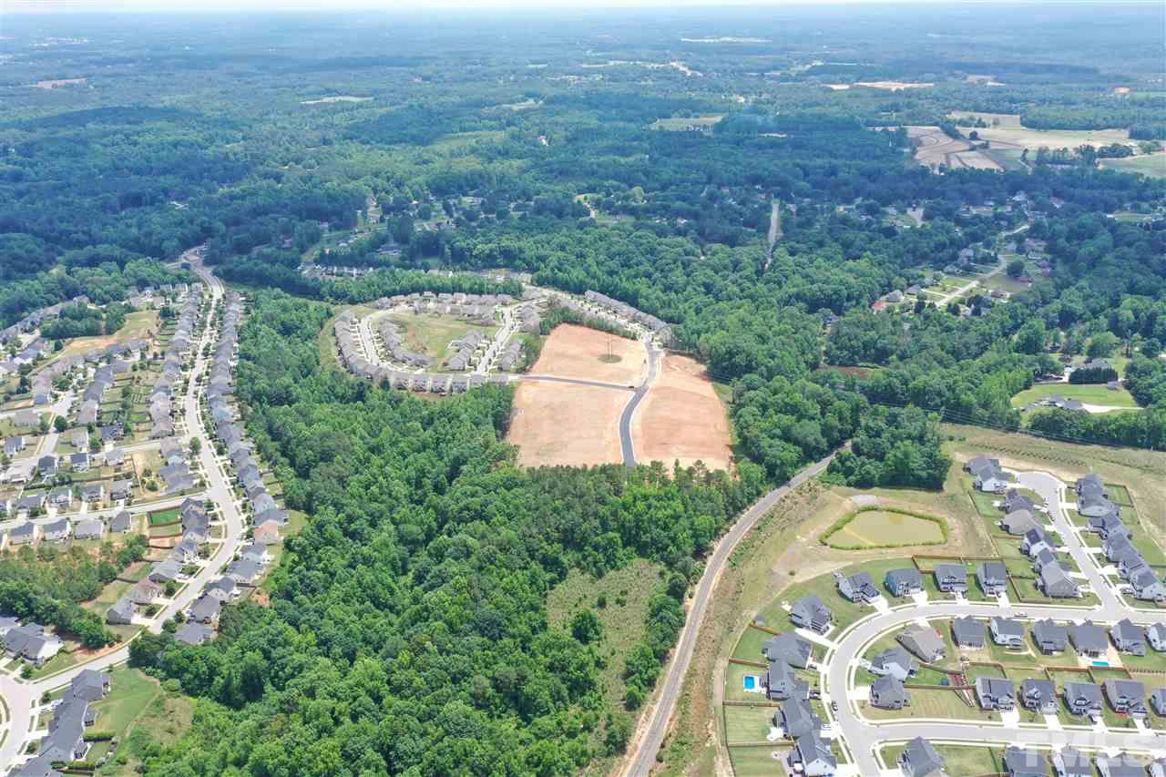 0 Fleming Loop Road Fuquay-Varina, NC 27526 - Photo 3 of 7 an aerial view of a house with a yard and lake view