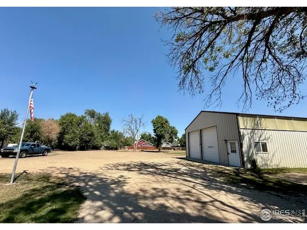 a view of a barn with a yard