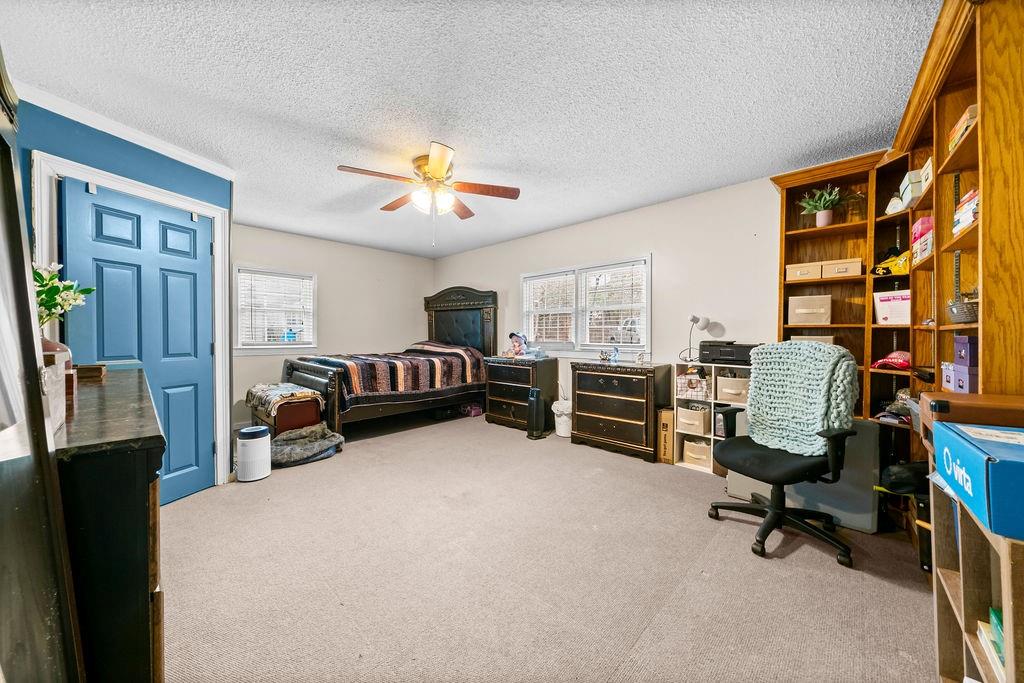 1763 Burnett Ferry Road Southwest Rome, GA 30165 - Photo 17 of 31 a view of a livingroom with furniture and a ceiling fan