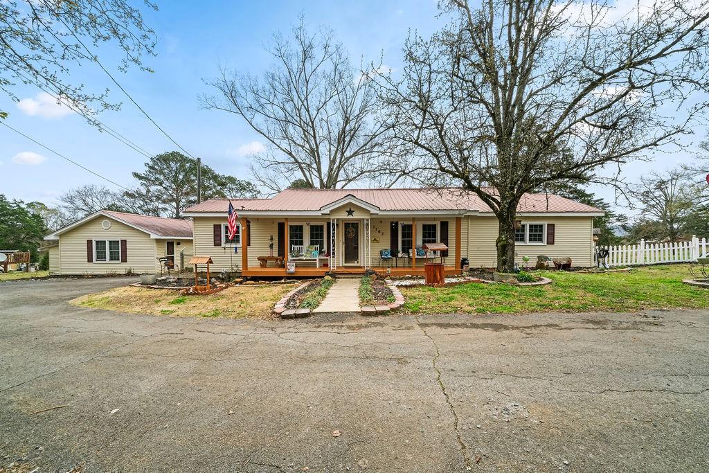 1763 Burnett Ferry Road Southwest Rome, GA 30165 - Photo 2 of 31 a view of house with outdoor space and view of house
