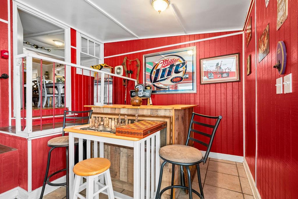 1763 Burnett Ferry Road Southwest Rome, GA 30165 - Photo 22 of 31 a view of a room with chairs and a dining table