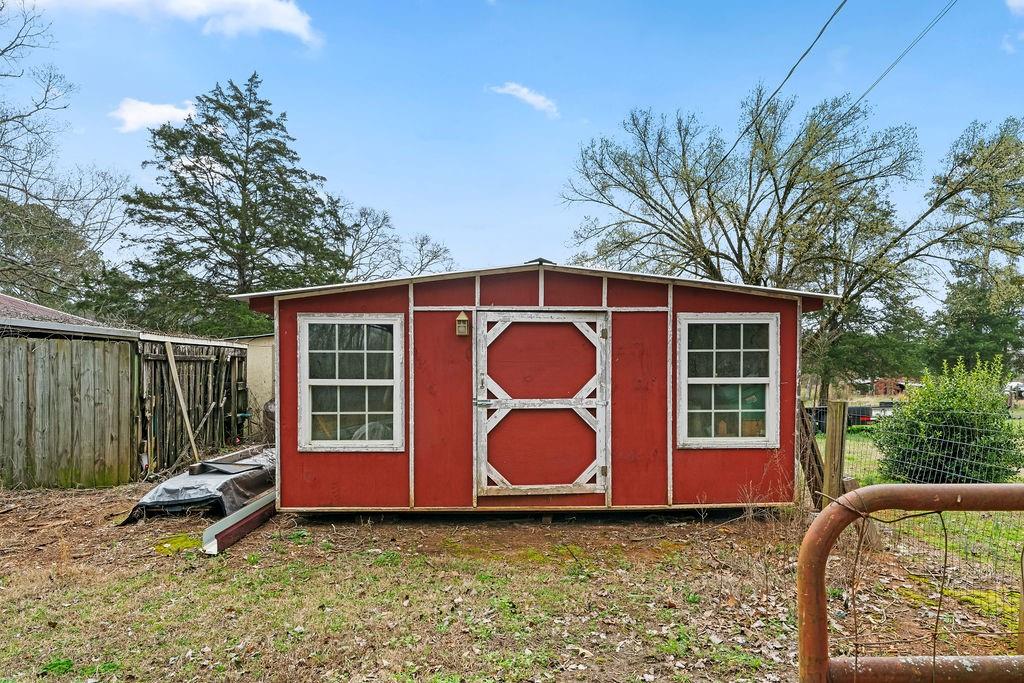 1763 Burnett Ferry Road Southwest Rome, GA 30165 - Photo 23 of 31 a view of a barn with a yard