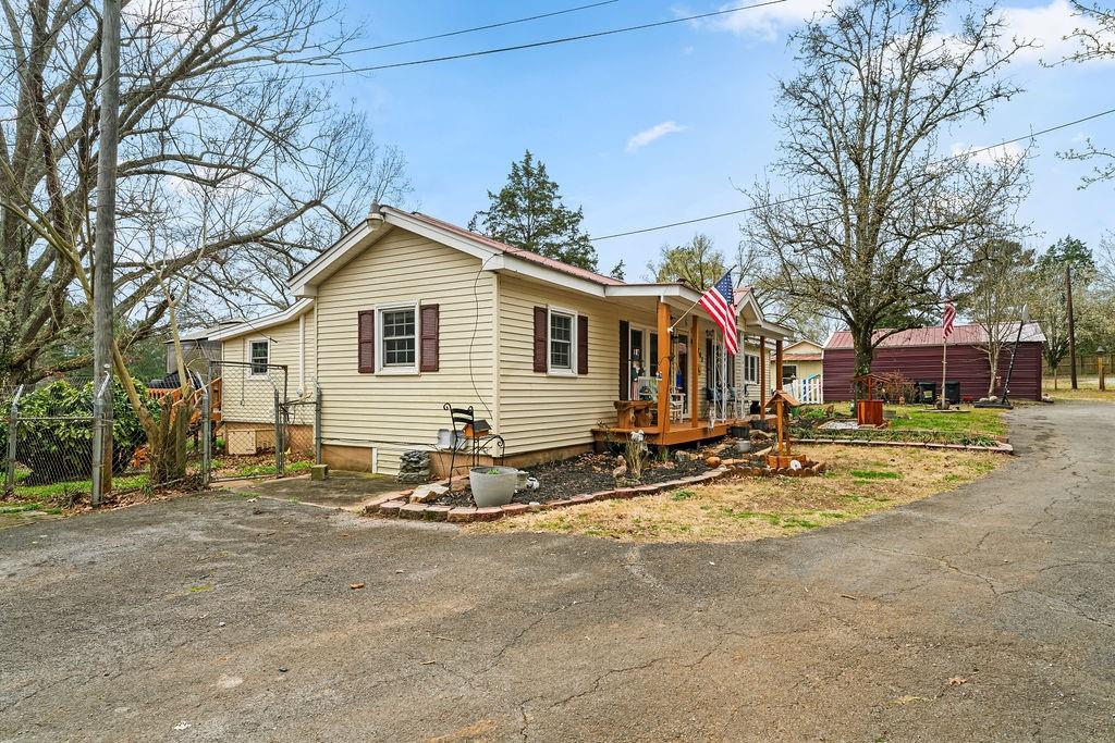 1763 Burnett Ferry Road Southwest Rome, GA 30165 - Photo 24 of 31 a view of a house with snow on the road