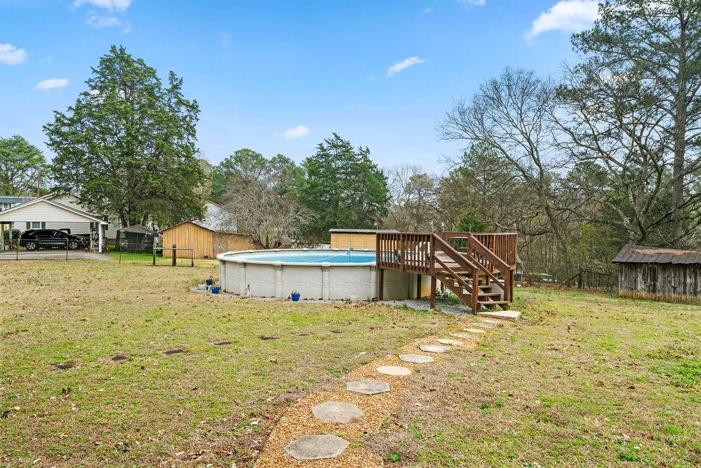 1763 Burnett Ferry Road Southwest Rome, GA 30165 - Photo 31 of 31 a view of a house with a yard