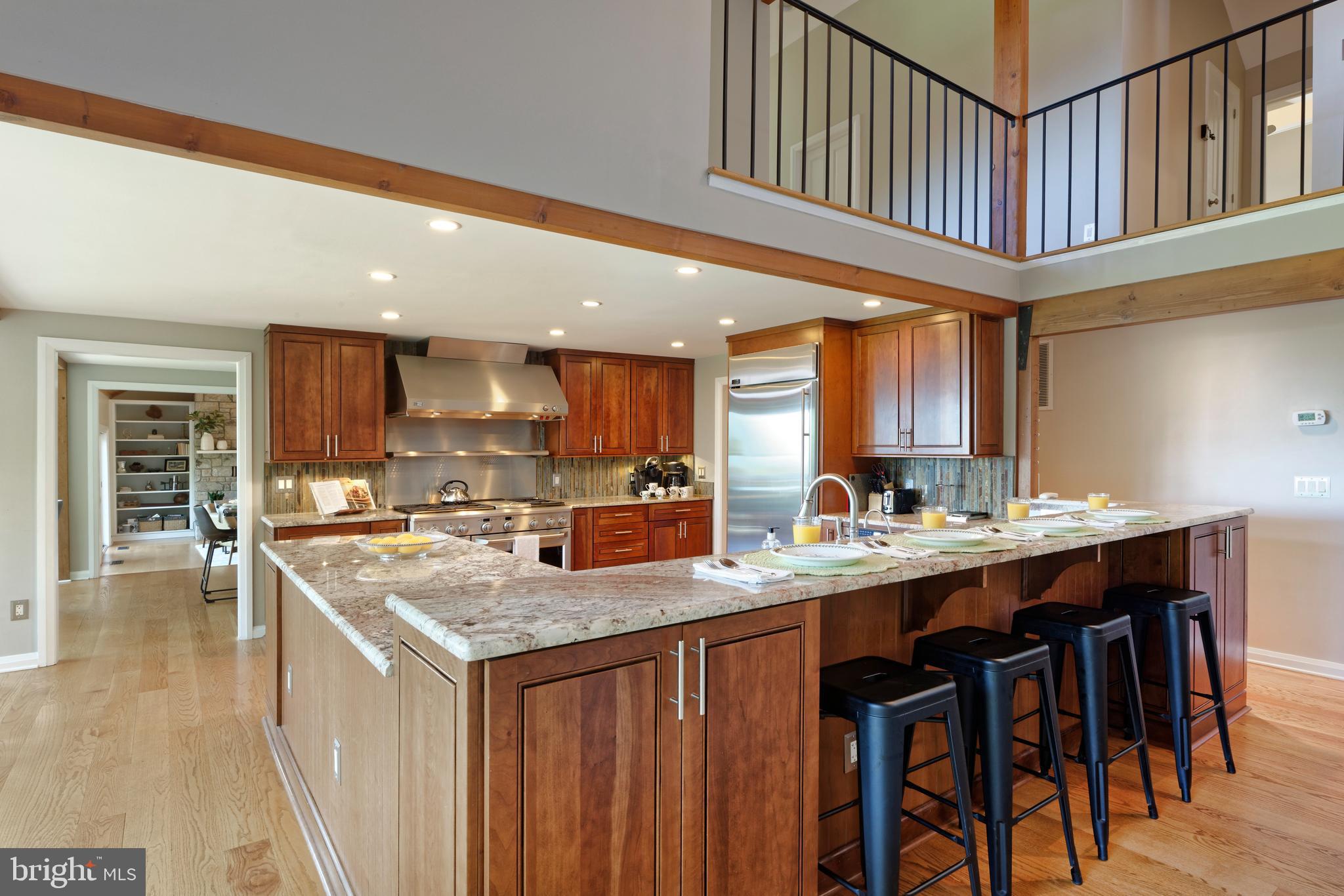 20615 Blue Ridge Mountain Road Paris, VA 20130 - Photo 12 of 80 a kitchen with stainless steel appliances granite countertop a kitchen island a stove a sink a dining table and chairs
