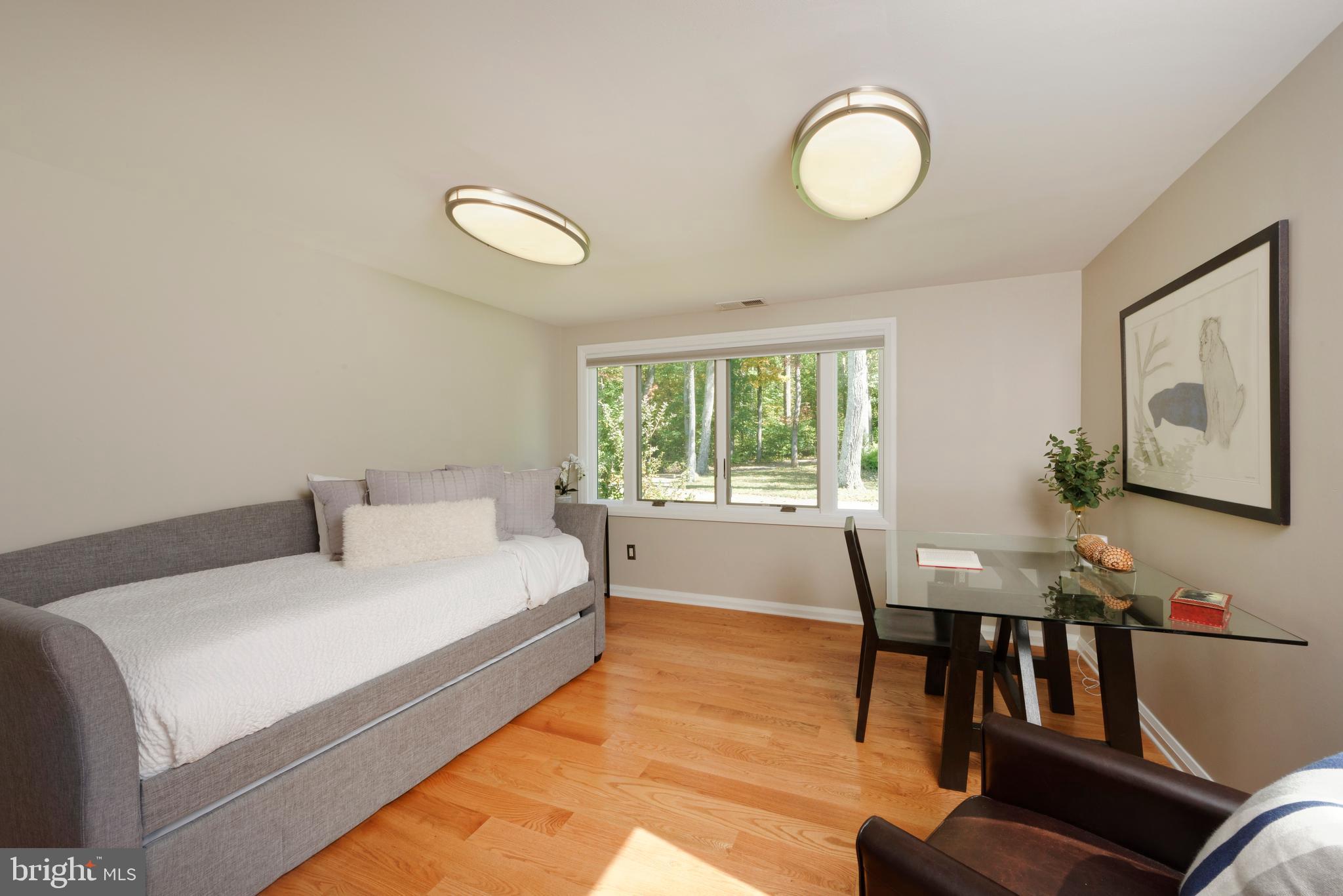 20615 Blue Ridge Mountain Road Paris, VA 20130 - Photo 23 of 80 a bedroom with a bed and a chandelier