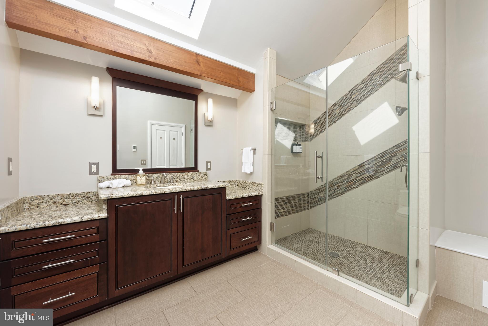 20615 Blue Ridge Mountain Road Paris, VA 20130 - Photo 27 of 80 a bathroom with a granite countertop sink mirror and