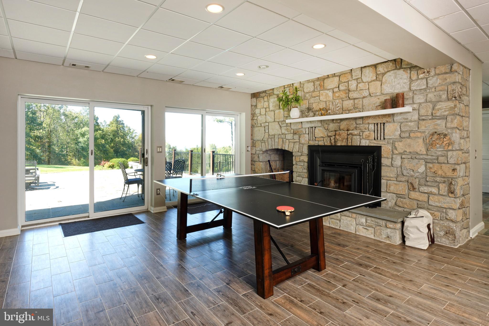 20615 Blue Ridge Mountain Road Paris, VA 20130 - Photo 35 of 80 a living room with furniture a fireplace and a table