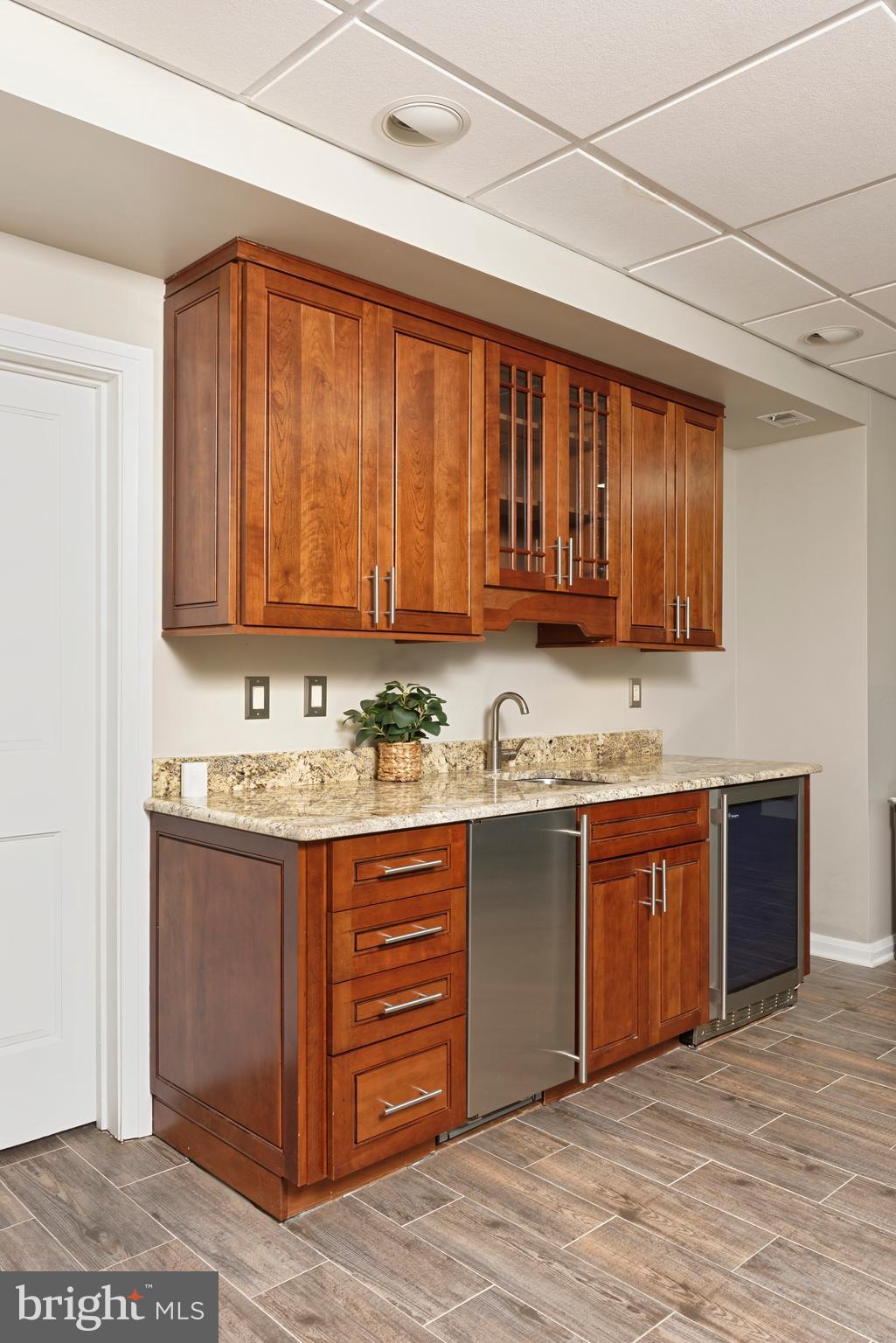 20615 Blue Ridge Mountain Road Paris, VA 20130 - Photo 36 of 80 a kitchen with stainless steel appliances granite countertop wooden cabinets a sink and dishwasher a stove top oven with wooden floor