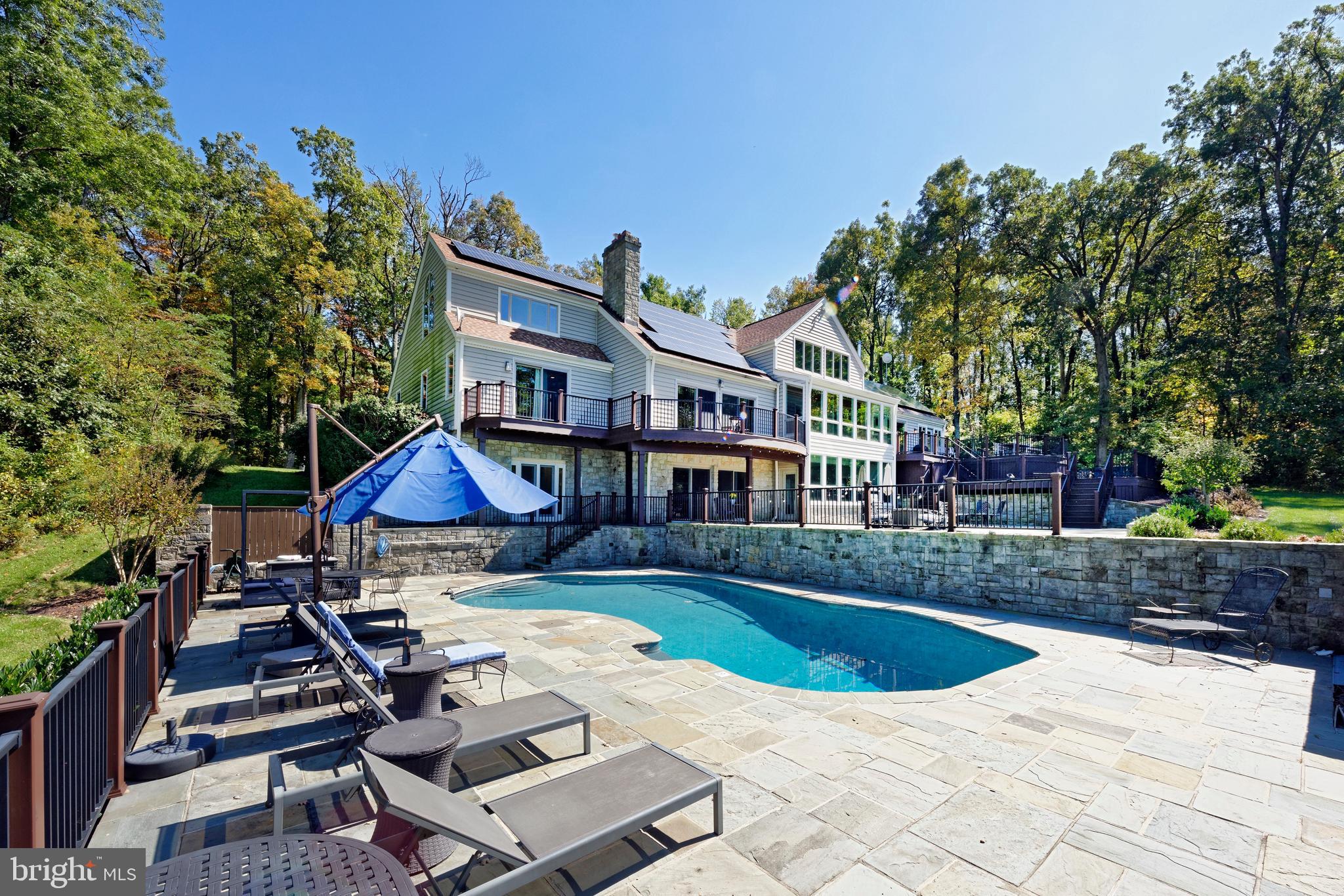 20615 Blue Ridge Mountain Road Paris, VA 20130 - Photo 44 of 80 a view of pool with lawn chairs and plants