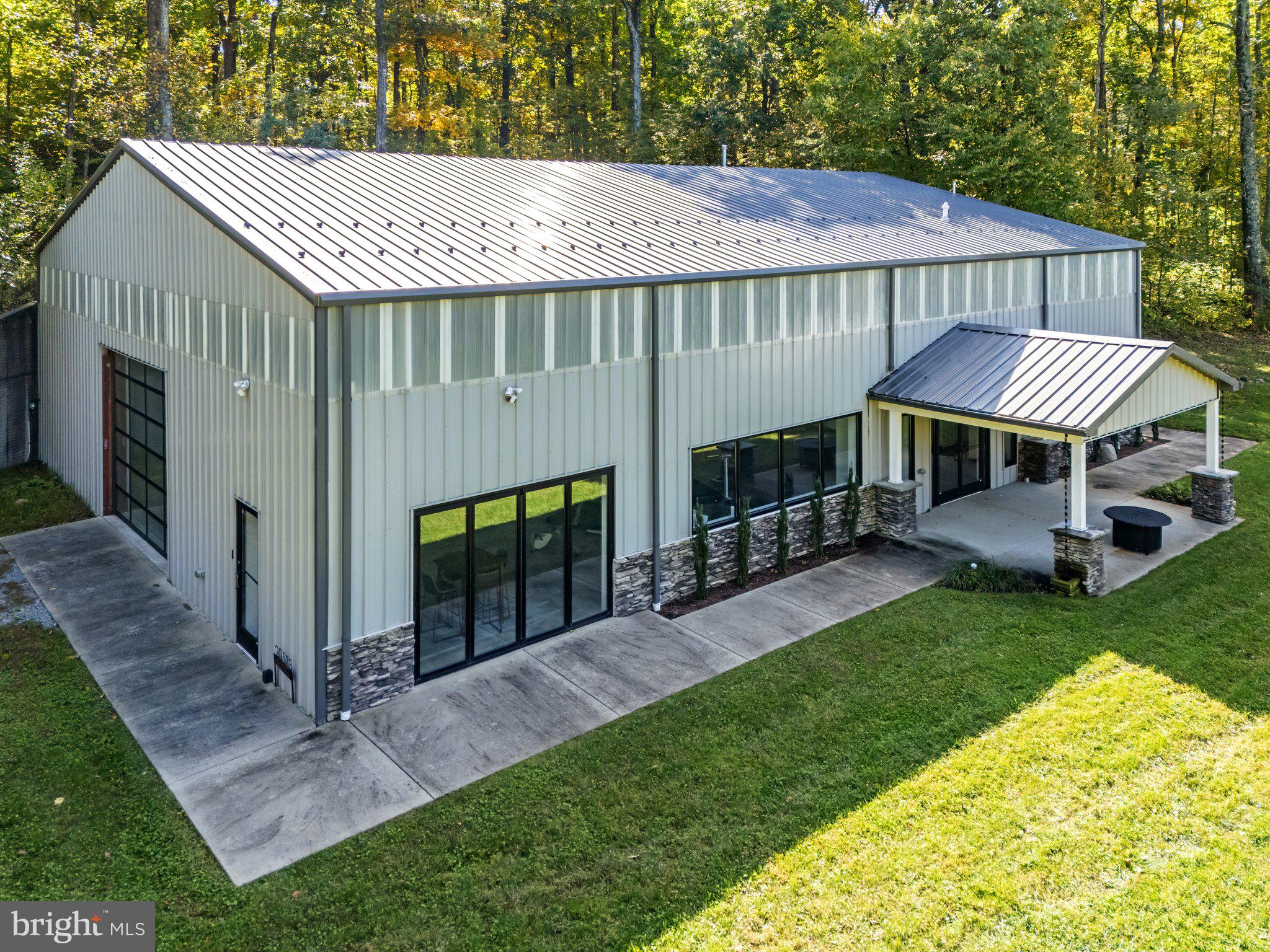 20615 Blue Ridge Mountain Road Paris, VA 20130 - Photo 52 of 80 a patio with a yard table and chairs