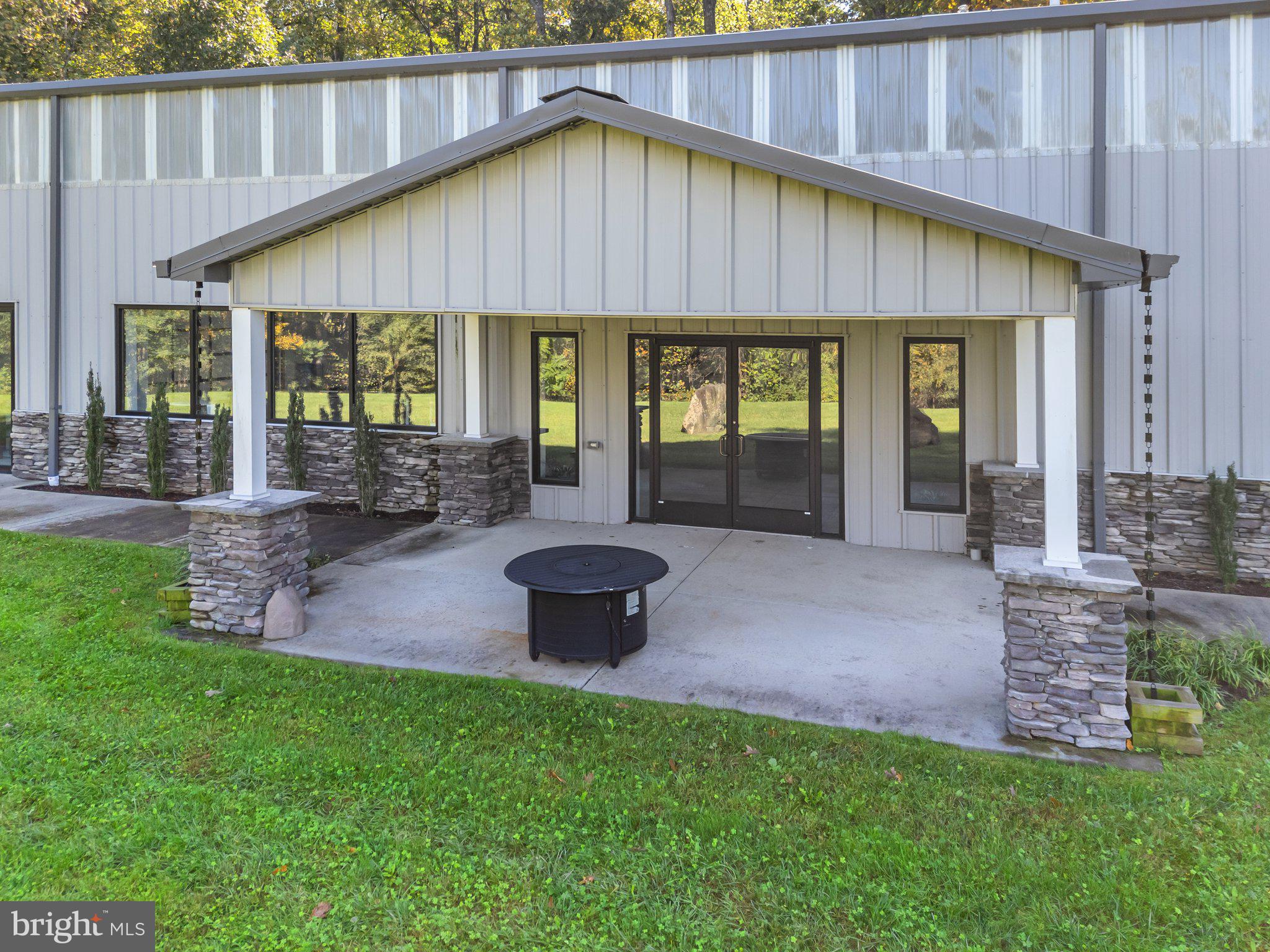 20615 Blue Ridge Mountain Road Paris, VA 20130 - Photo 53 of 80 a front view of a house with a yard porch and outdoor seating