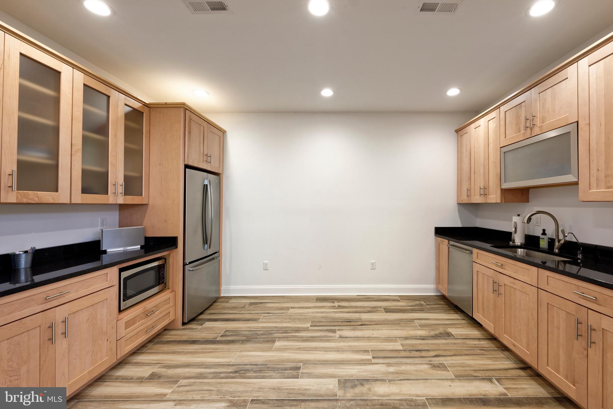 20615 Blue Ridge Mountain Road Paris, VA 20130 - Photo 57 of 80 a kitchen with granite countertop a sink and cabinets