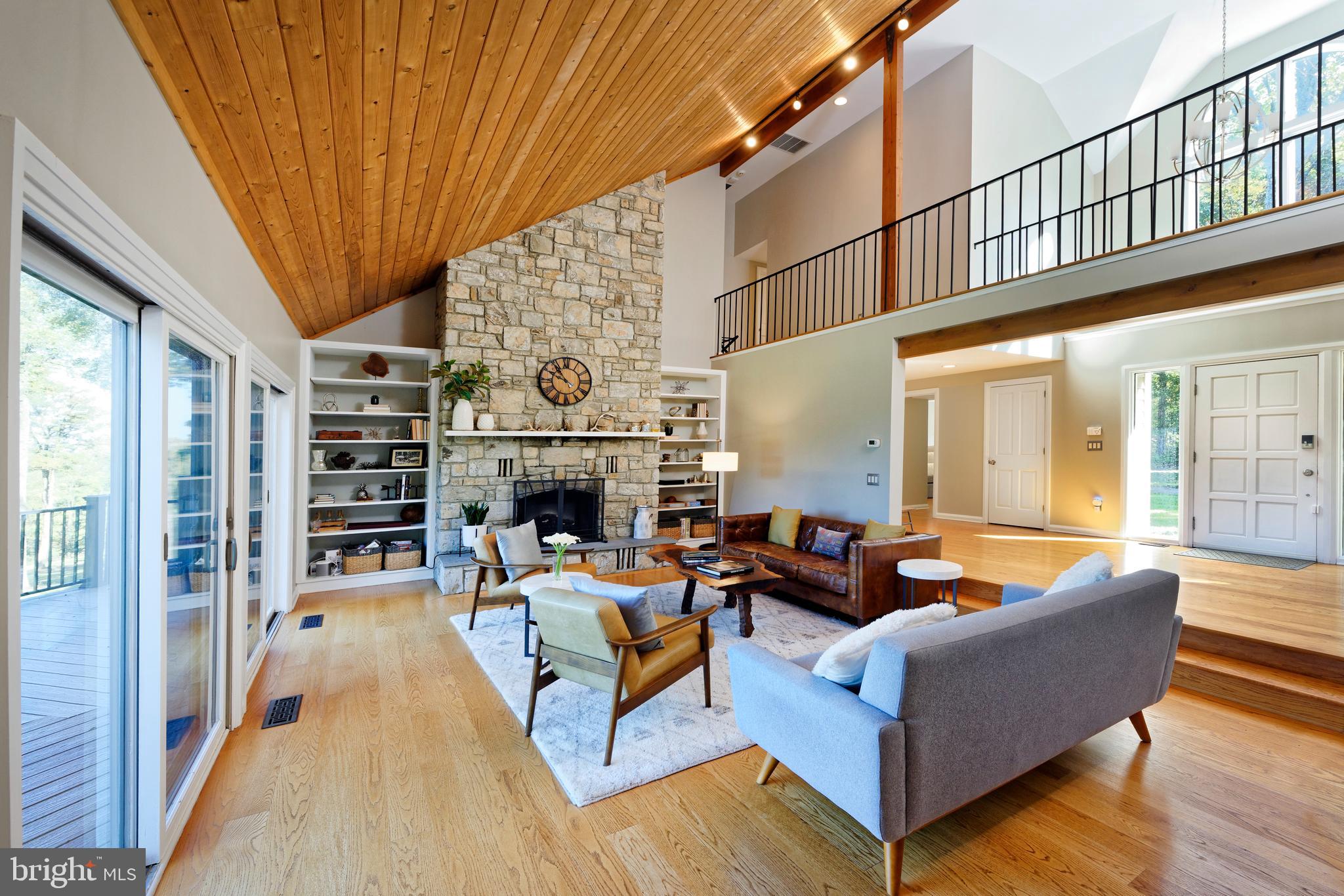 20615 Blue Ridge Mountain Road Paris, VA 20130 - Photo 9 of 80 a living room with fireplace furniture and a wooden floor