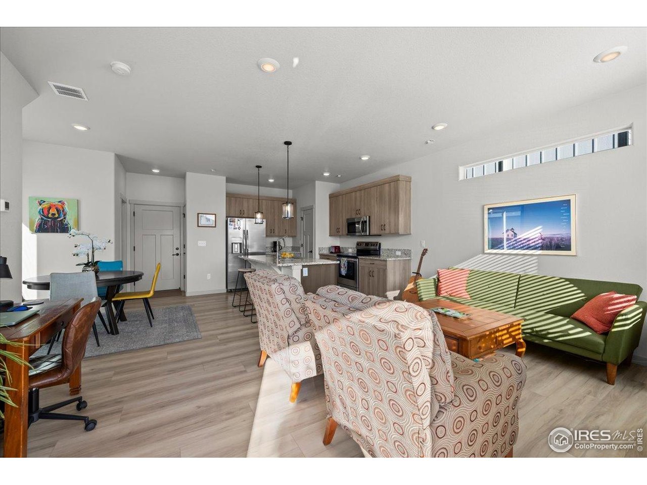 1088 Blue Bell Road Berthoud, CO 80513 - Photo 8 of 33 a living room with furniture and a wooden floor