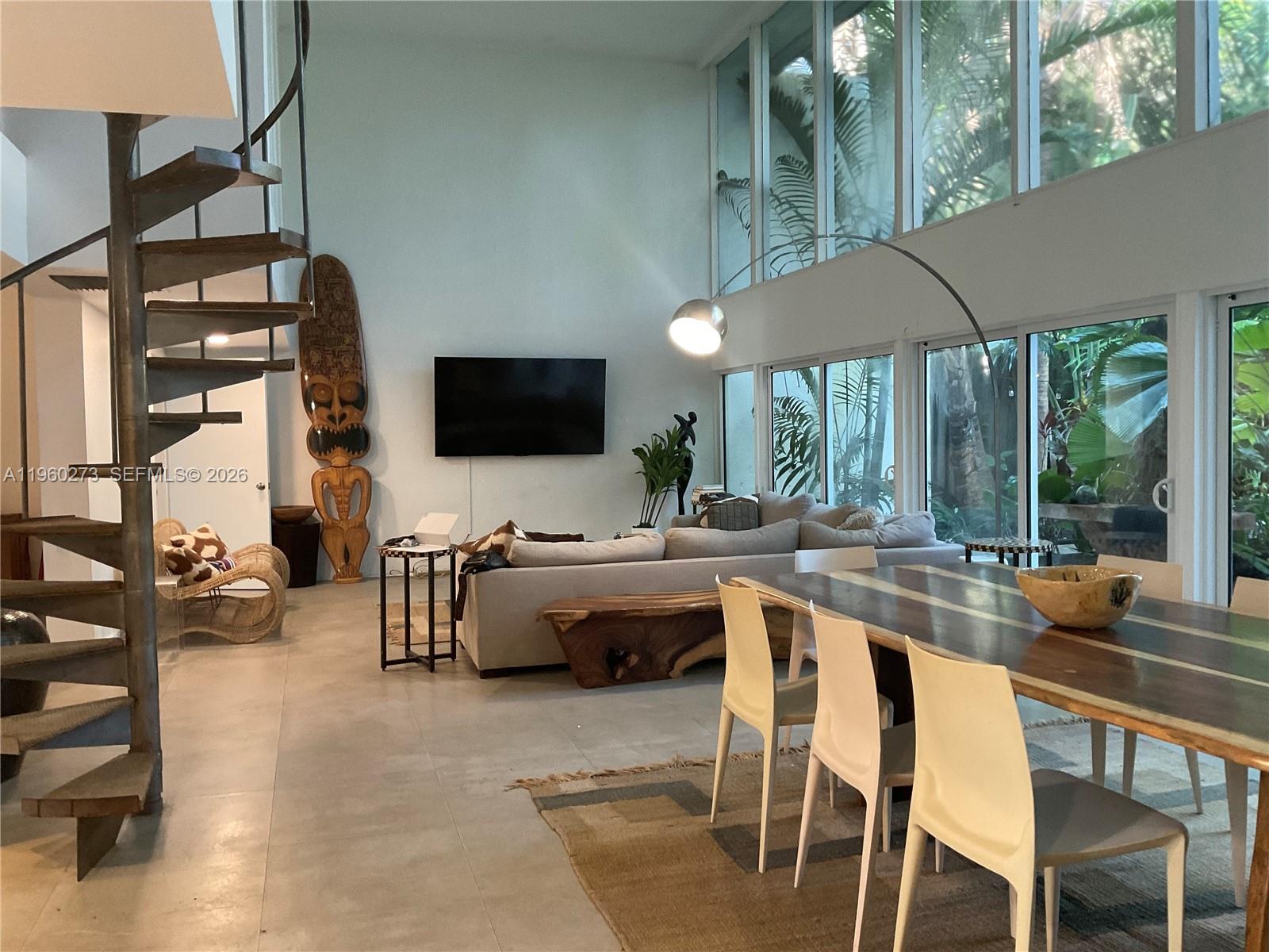 2485 Inagua Avenue Miami, FL 33133 - Photo 13 of 17 a view of a dining table and chairs in the patio