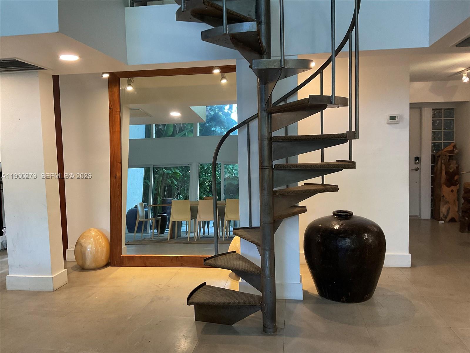 2485 Inagua Avenue Miami, FL 33133 - Photo 5 of 17 a living room with furniture and a large window