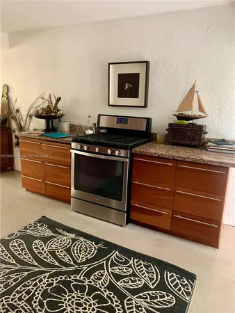 a kitchen with a stove and cabinets