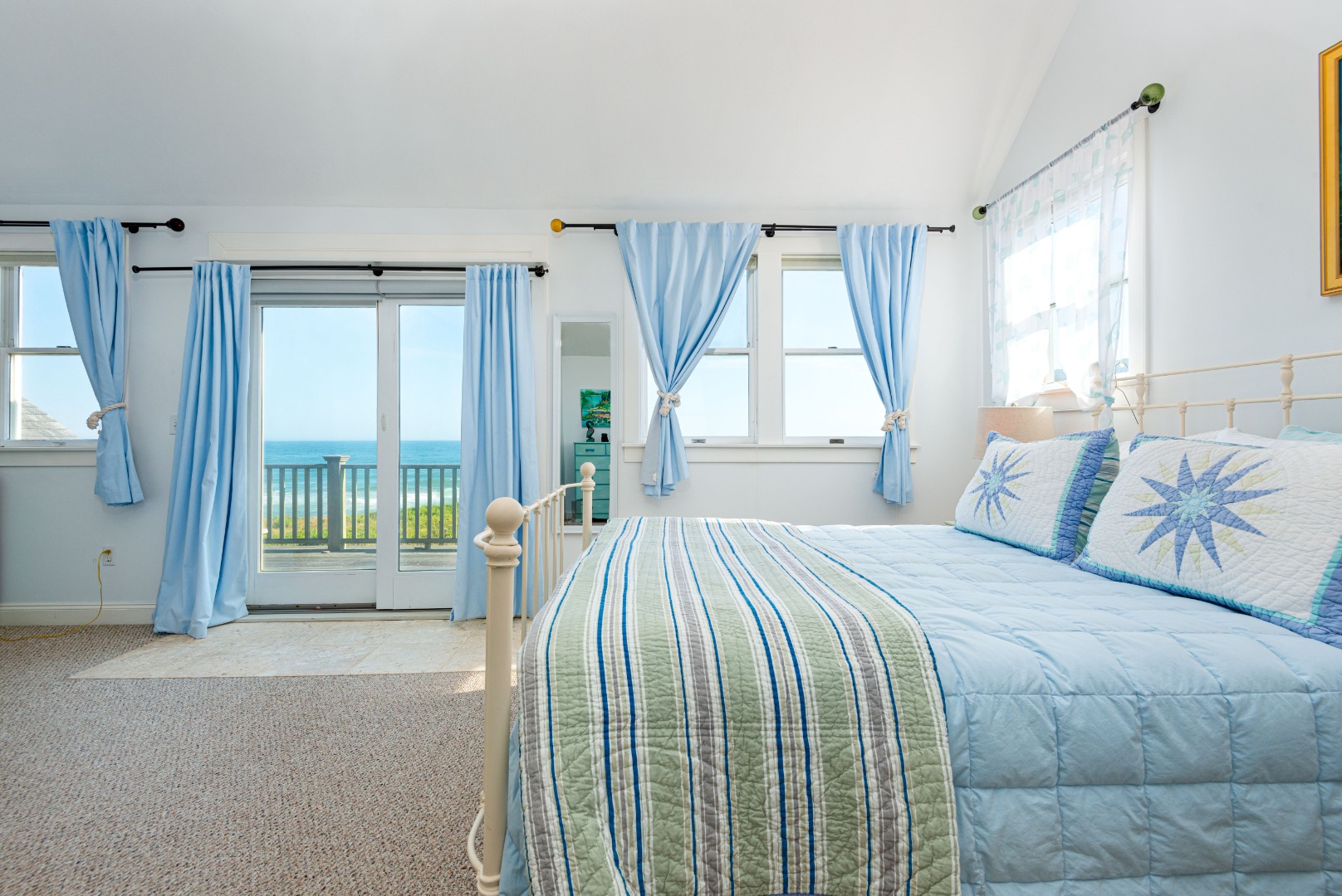 56 R Madequecham Valley Road Nantucket, MA 02554 - Photo 37 of 52 a spacious bedroom with a bed and a large window