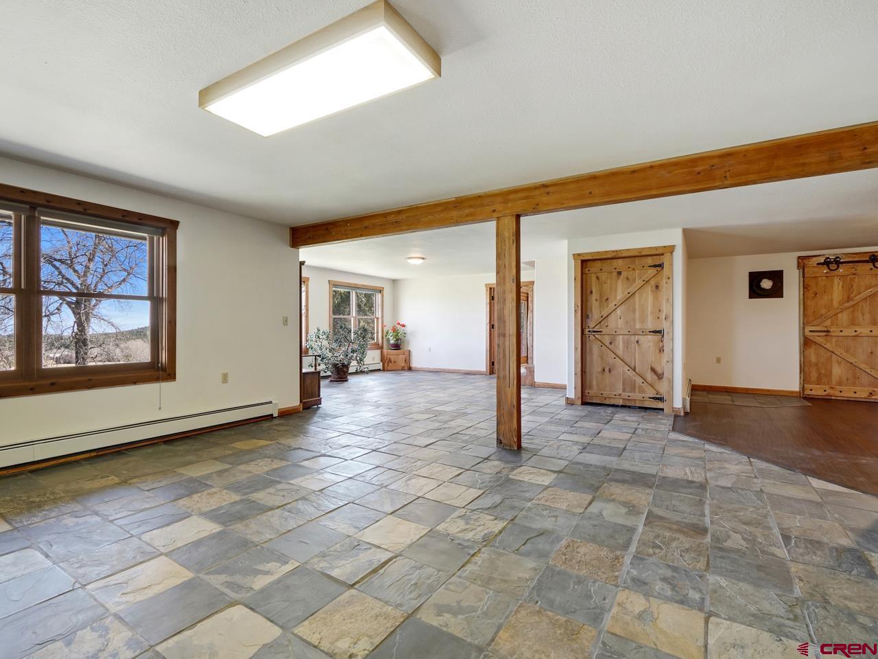 19795 High Park Road Cedaredge, CO 81413 - Photo 17 of 35 a view of a big room with windows and closet