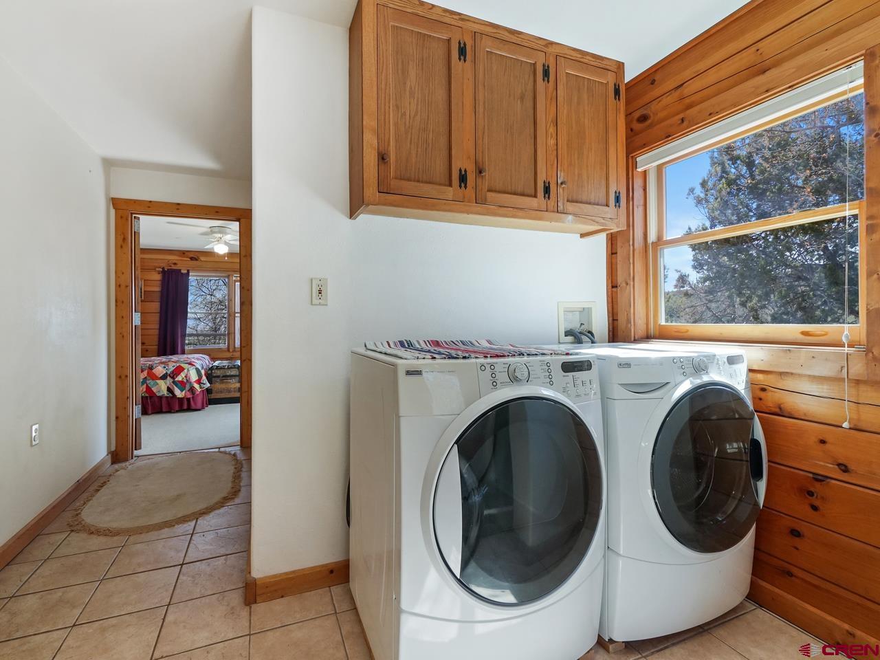 19795 High Park Road Cedaredge, CO 81413 - Photo 6 of 35 a view of a storage & utility room with washer and dryer