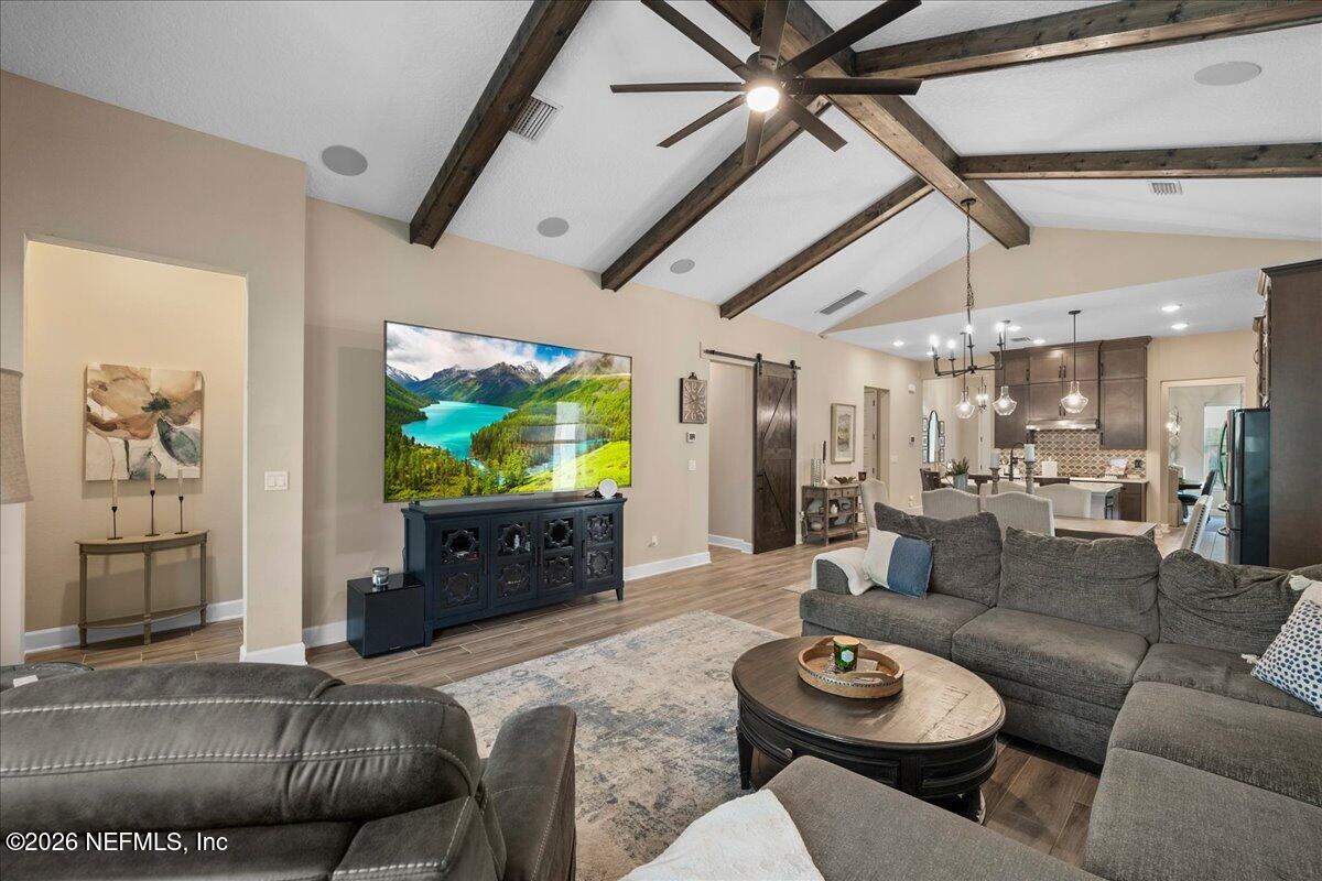 11098 Engineering Way Jacksonville, FL 32256 - Photo 17 of 62 a living room with furniture and a flat screen tv