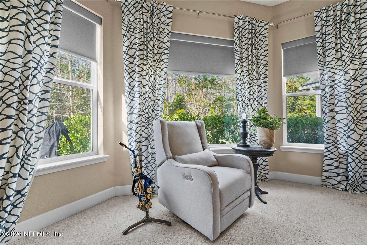 11098 Engineering Way Jacksonville, FL 32256 - Photo 19 of 62 a bed room with a bed and a chair