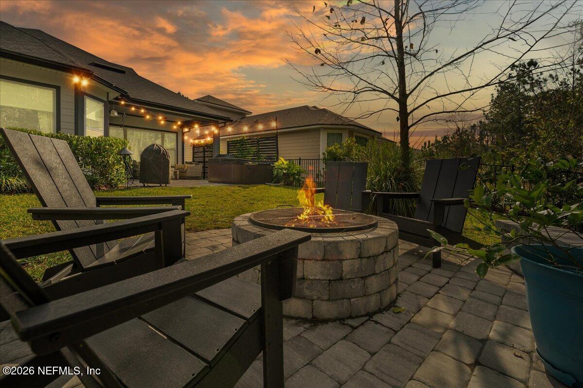 11098 Engineering Way Jacksonville, FL 32256 - Photo 2 of 62 a view of a patio with table and chairs and potted plants