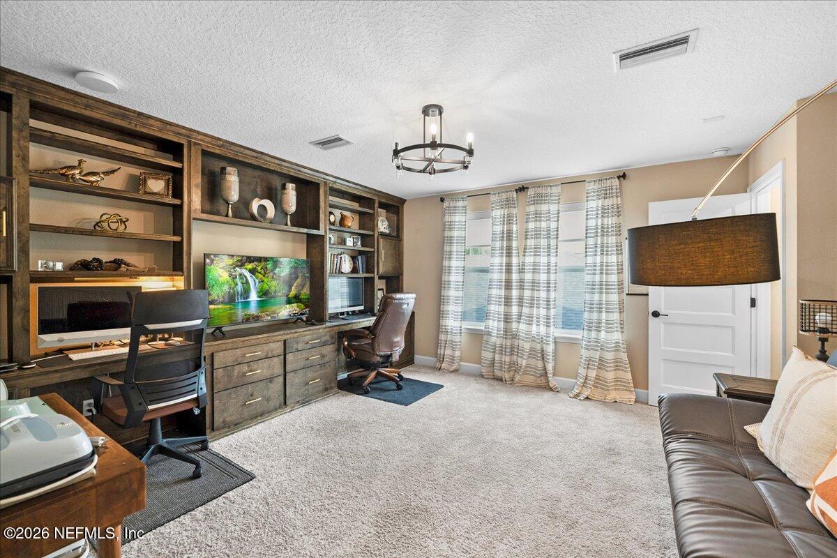 11098 Engineering Way Jacksonville, FL 32256 - Photo 29 of 62 a view of a livingroom with workspace and a window
