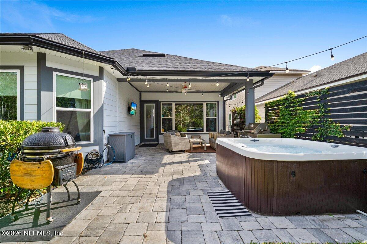 11098 Engineering Way Jacksonville, FL 32256 - Photo 35 of 62 a view of a patio with table and chairs and wooden fence
