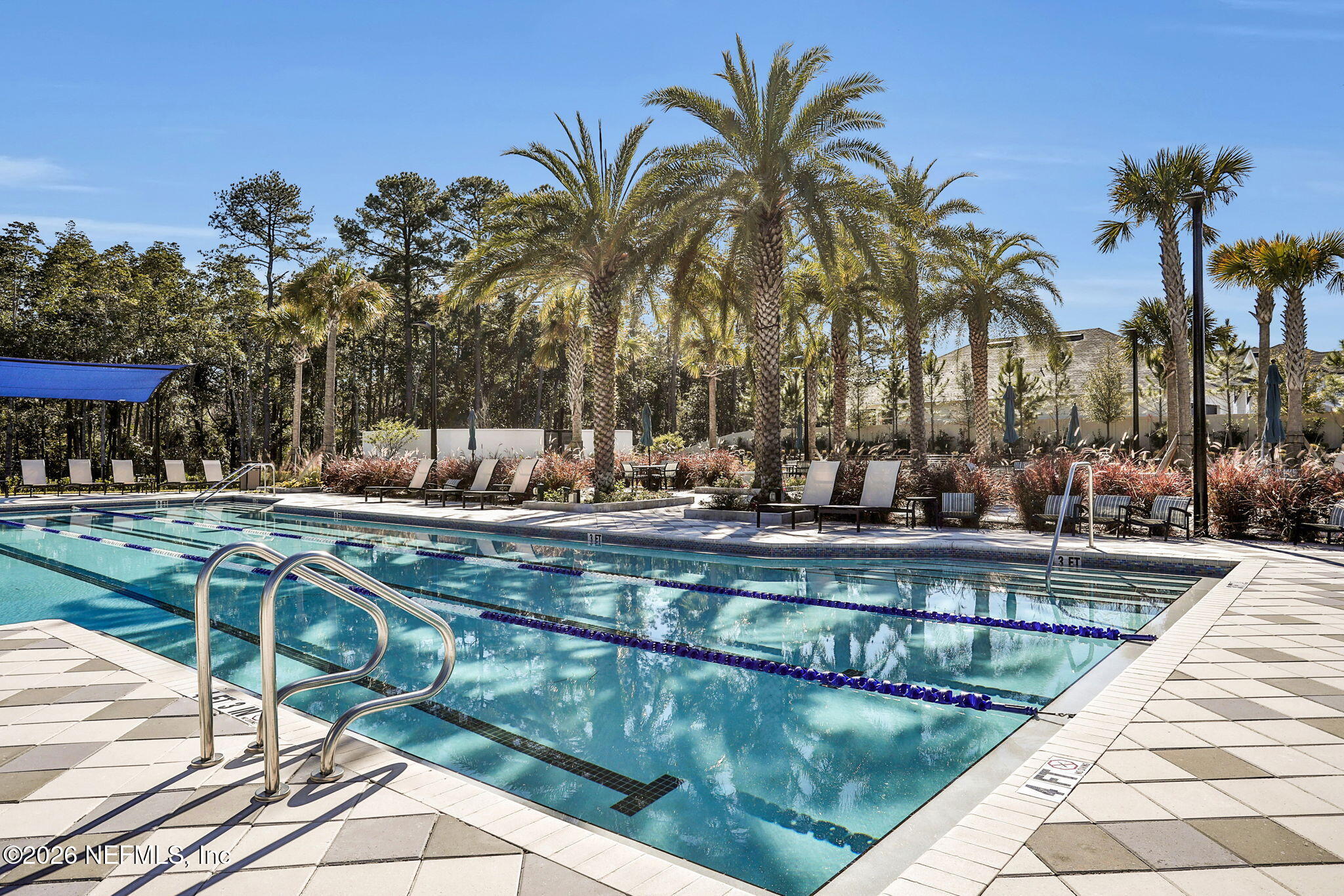 11098 Engineering Way Jacksonville, FL 32256 - Photo 45 of 62 a view of swimming pool with a table and chairs