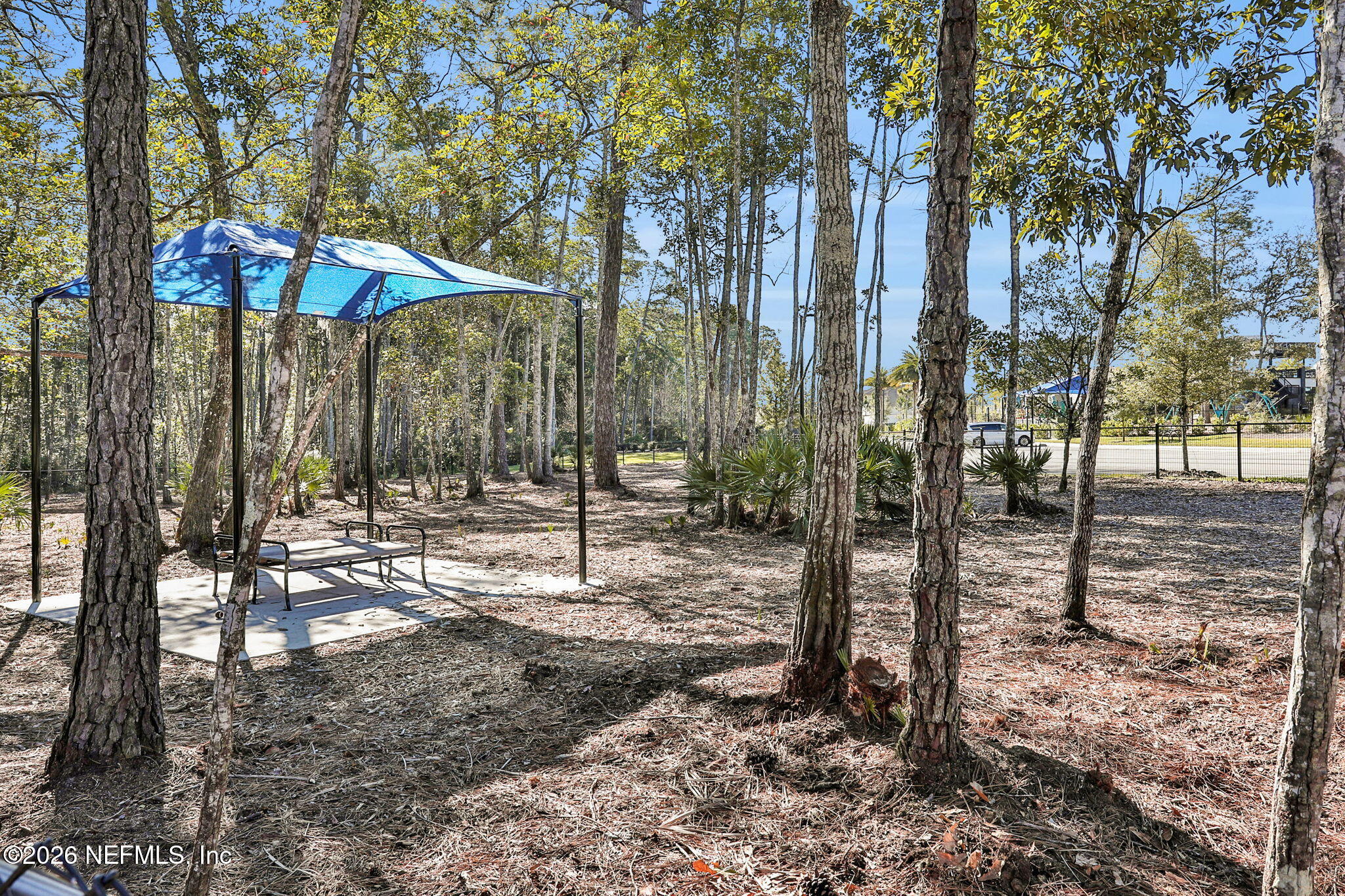 11098 Engineering Way Jacksonville, FL 32256 - Photo 48 of 62 a backyard of a house with table and chairs