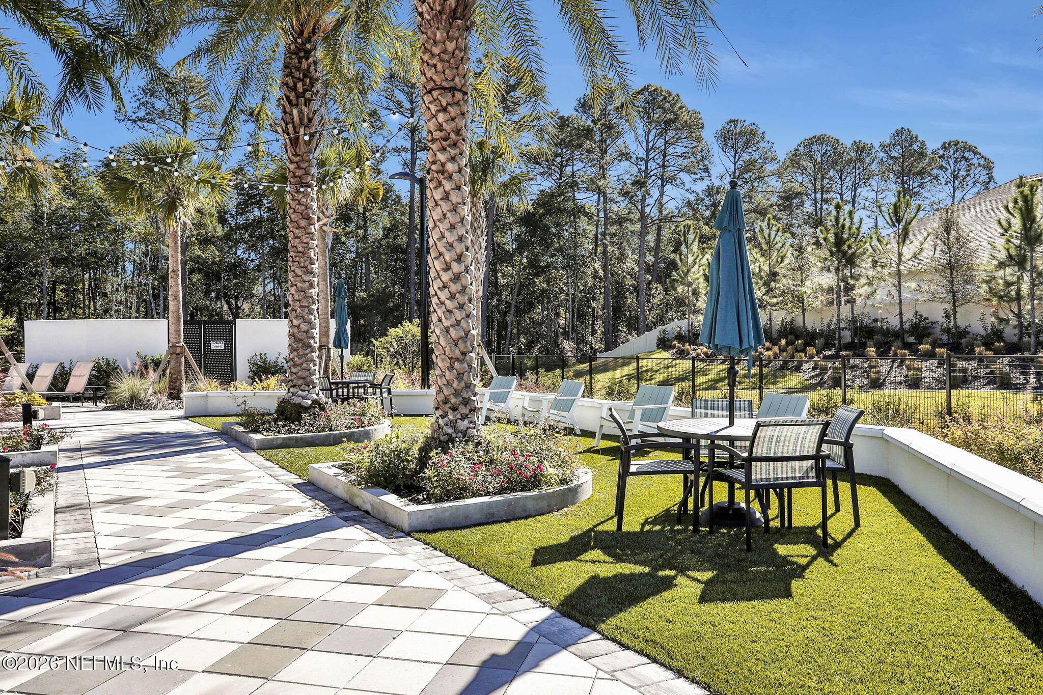 11098 Engineering Way Jacksonville, FL 32256 - Photo 49 of 62 a swimming pool with outdoor seating and yard