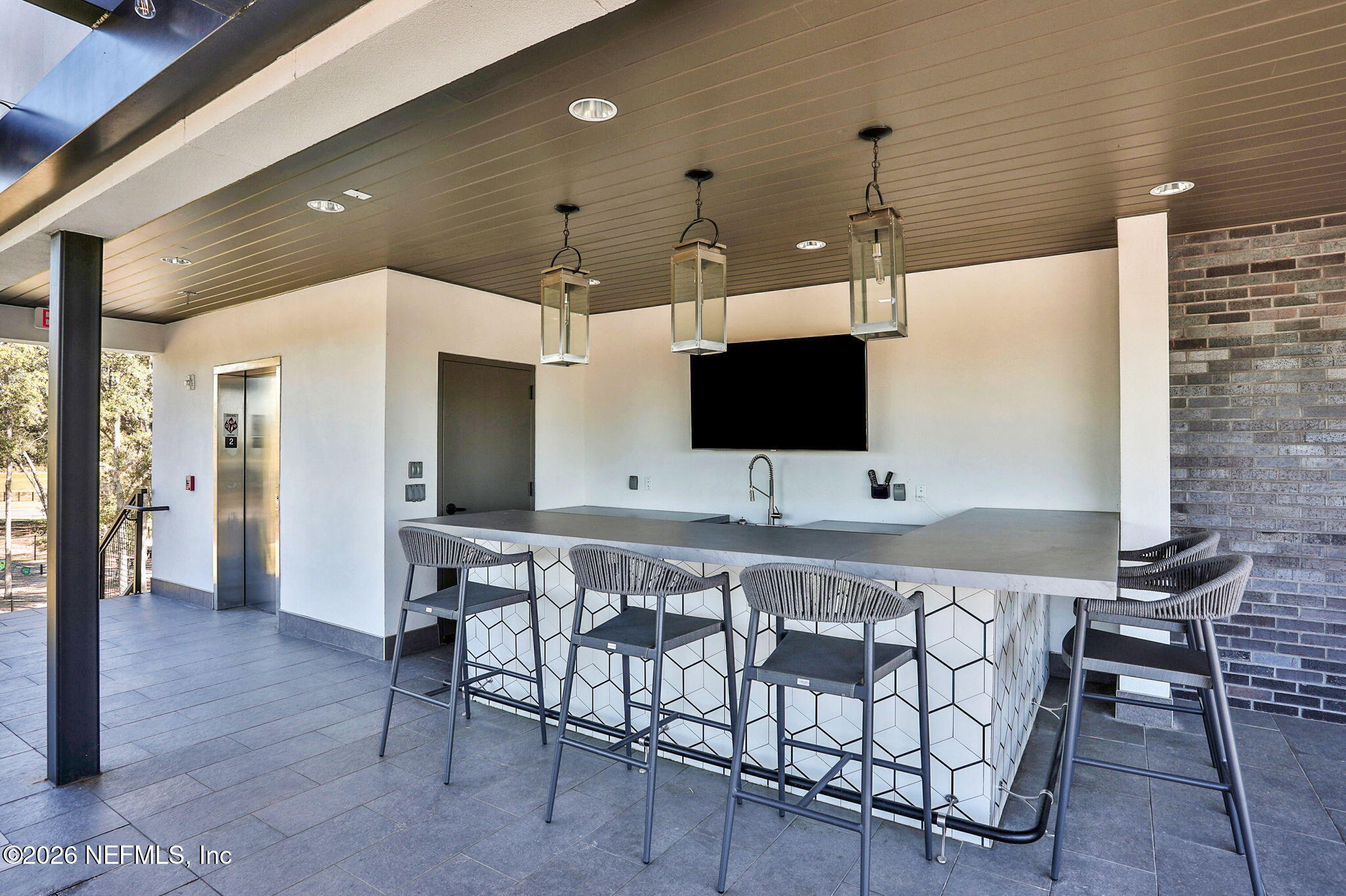 11098 Engineering Way Jacksonville, FL 32256 - Photo 56 of 62 a living room with furniture and a flat screen tv