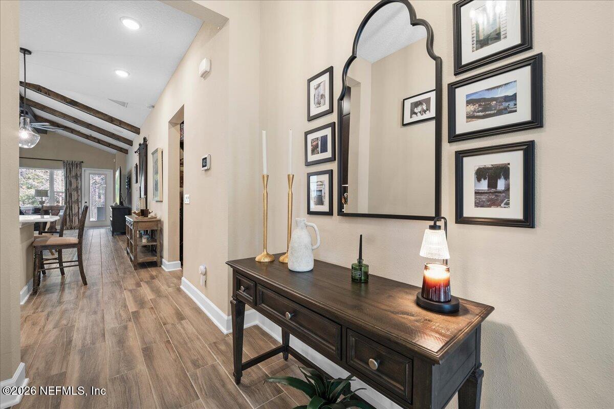 11098 Engineering Way Jacksonville, FL 32256 - Photo 6 of 62 a view of hall way with furniture and wooden floor