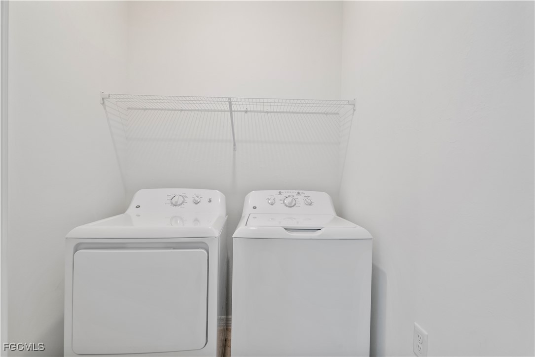 43977 Boardwalk Loop, Unit 2338 Punta Gorda, FL 33982 - Photo 2 of 50 a utility room with dryer and washer