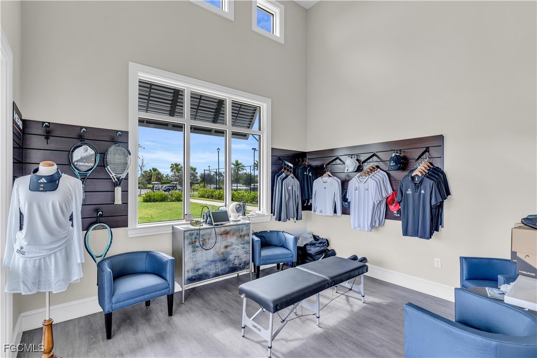 43977 Boardwalk Loop, Unit 2338 Punta Gorda, FL 33982 - Photo 29 of 50 a living room with furniture and a floor to ceiling window