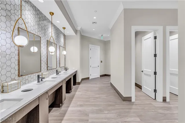 a large bathroom with a double vanity sink and a mirror