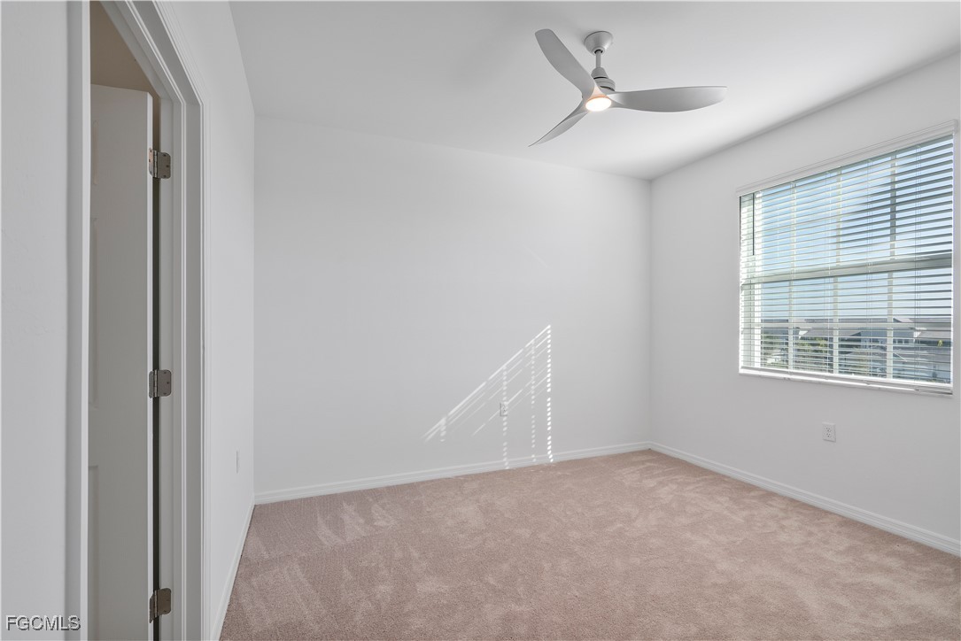 43977 Boardwalk Loop, Unit 2338 Punta Gorda, FL 33982 - Photo 3 of 50 an empty room with a window and a ceiling fan