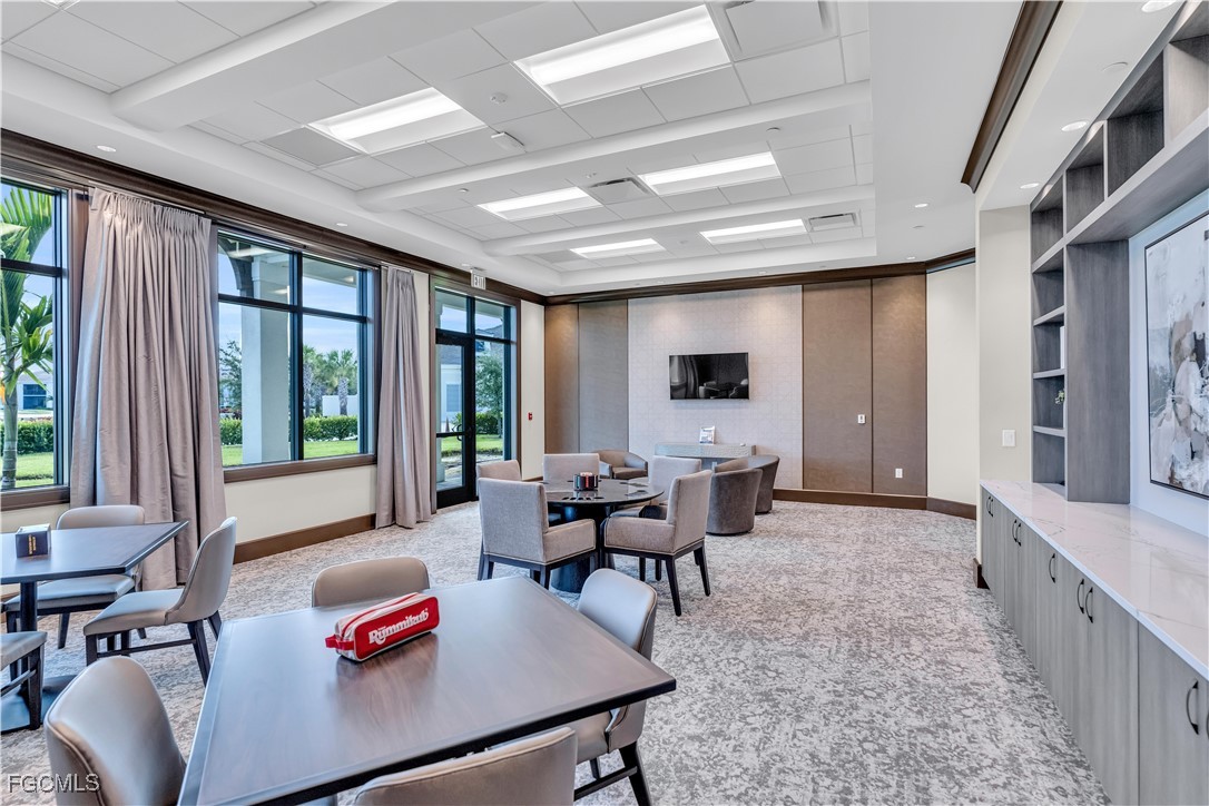 43977 Boardwalk Loop, Unit 2338 Punta Gorda, FL 33982 - Photo 32 of 50 a living room with furniture and a large window