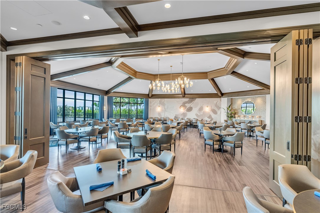 43977 Boardwalk Loop, Unit 2338 Punta Gorda, FL 33982 - Photo 35 of 50 a outdoor space with lots of tables a large window and chairs