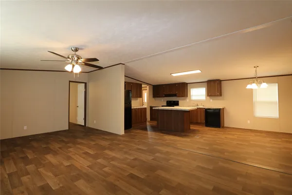 a view of a kitchen with a sink and a window