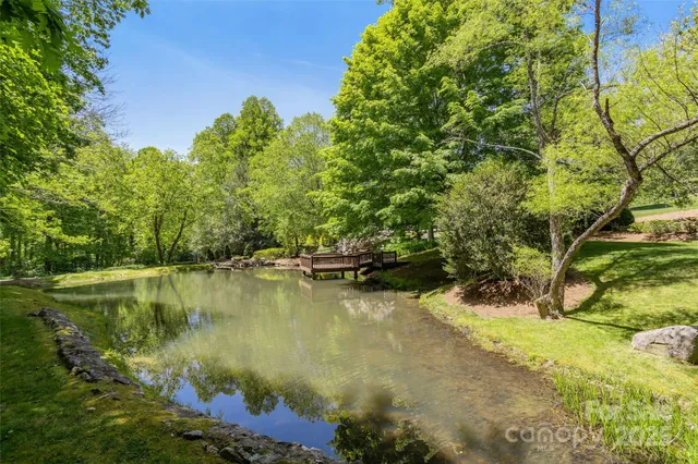 a view of a lake with a yard