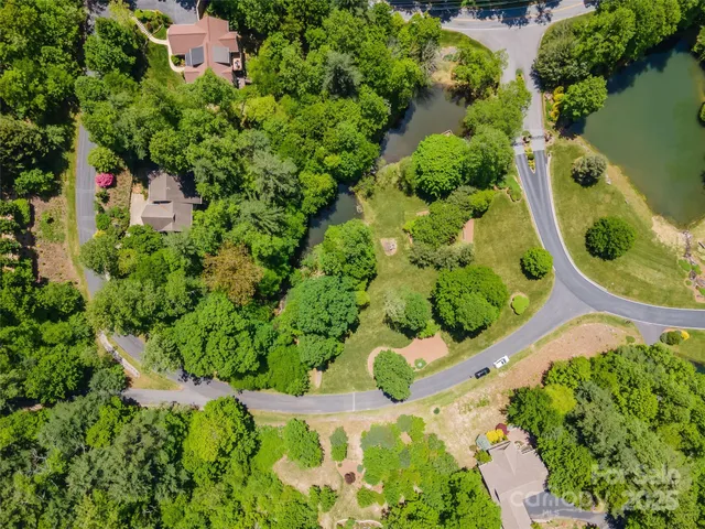 an aerial view of residential house with outdoor space and swimming pool