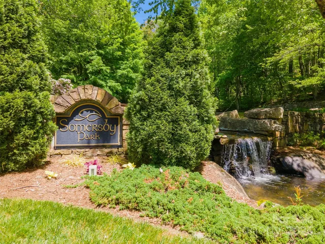 a backyard of a house with yard and outdoor seating