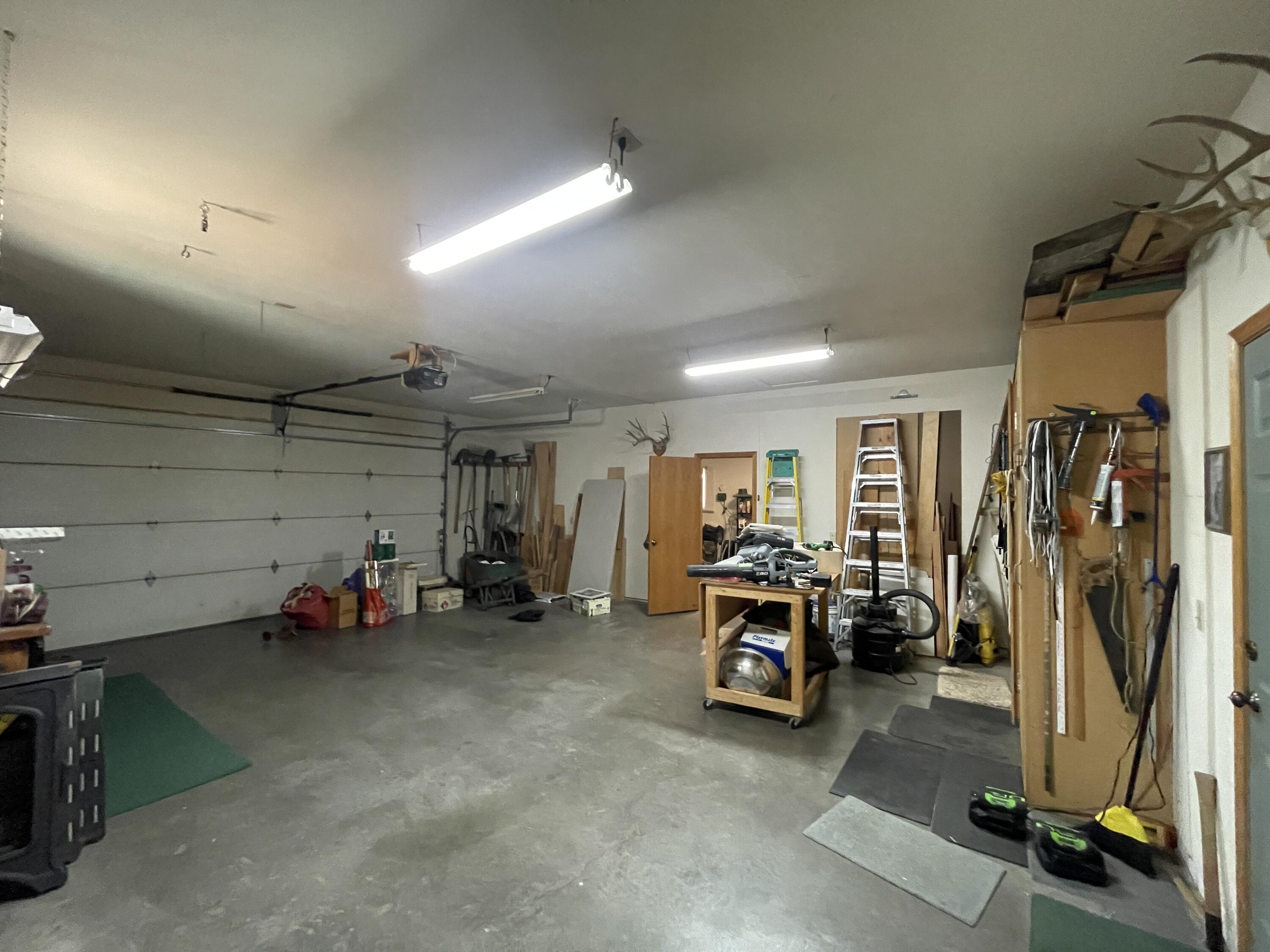 19761 Buck Canyon Road Bend, OR 97702 - Photo 21 of 33 Workshop space in 3 car garage