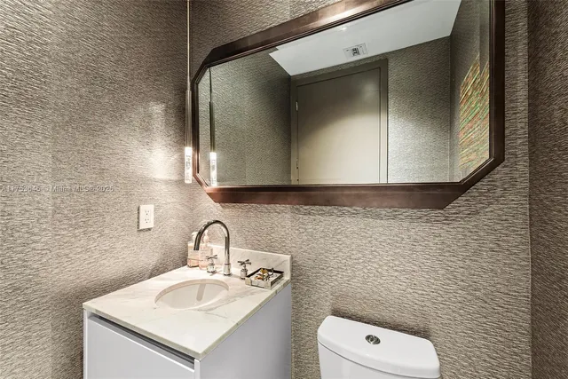 a lobby with furniture and a rug